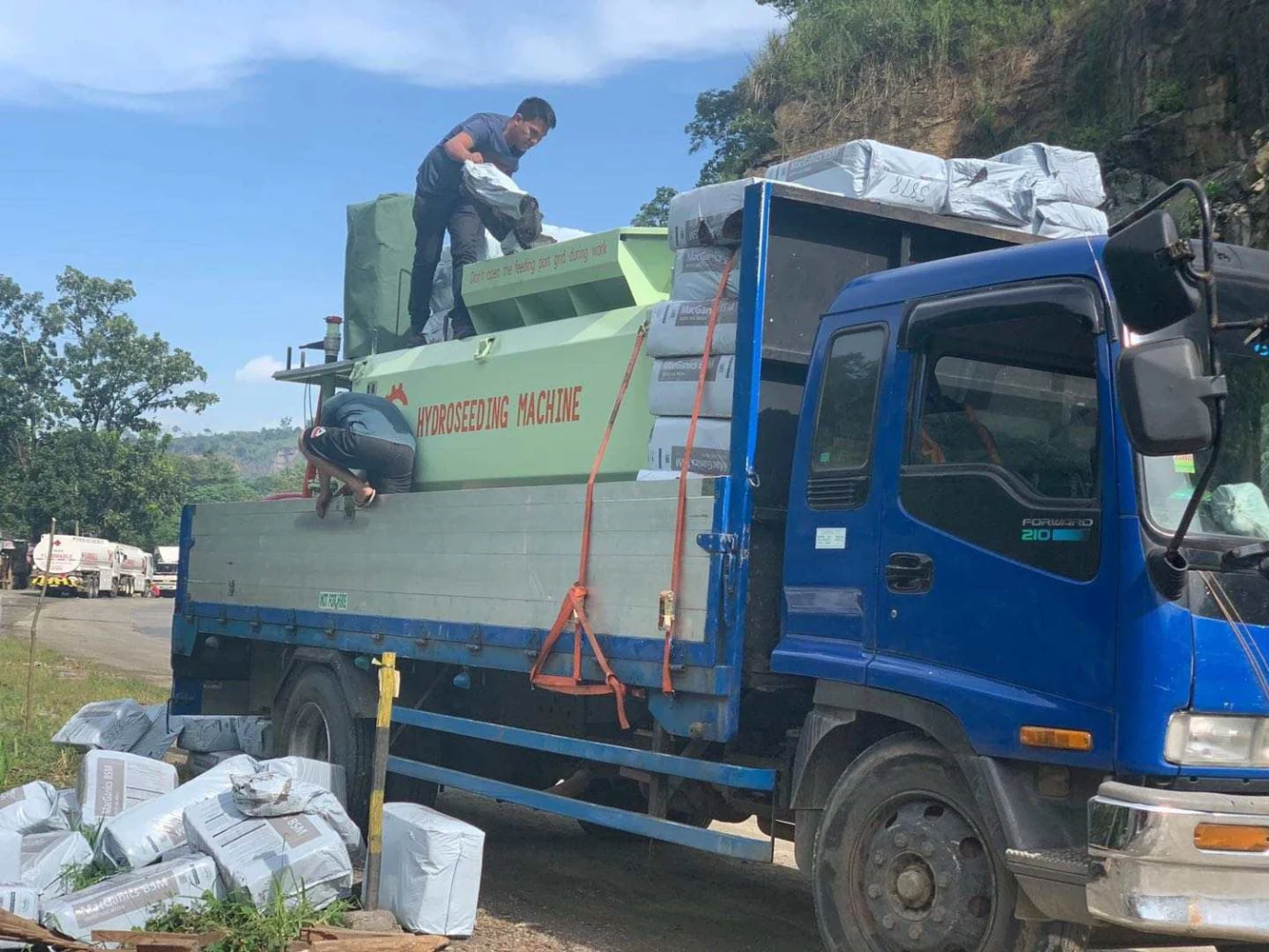 Supplied truck-mounted hydroseeding equipment at a site